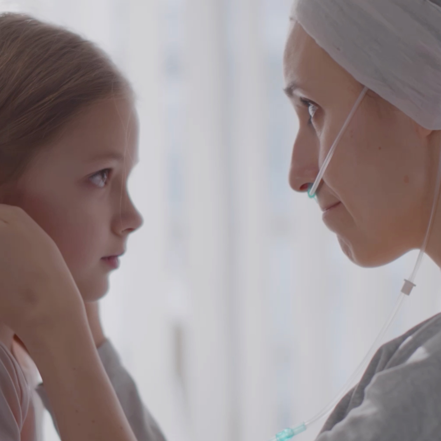 Young girl looking at a doctor in a medical setting