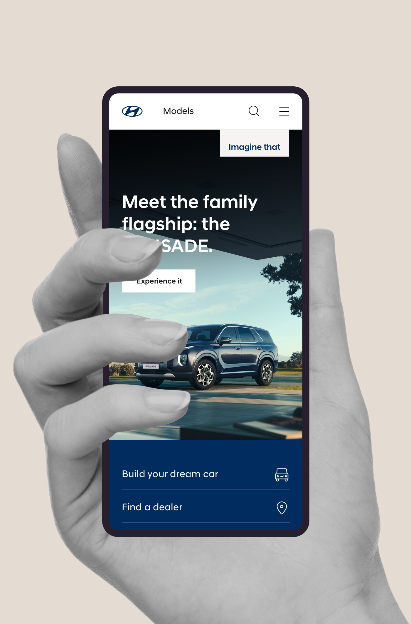 Hand holding smartphone displaying Hyundai Palisade app interface